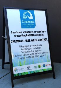 Signage that informs about Coastcare Volunteers at work in chemical-free weed control