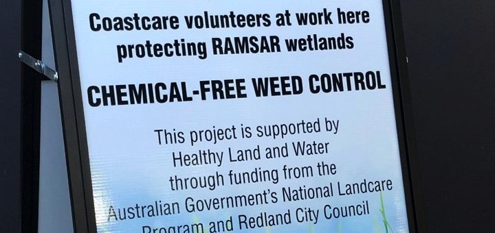 Signage that informs about Coastcare Volunteers at work in chemical-free weed control