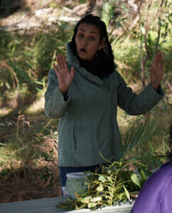 Quandamooka woman, Elisha Kissick, giving a talk on Coochiemudlo Island for NAIDOC 2022.